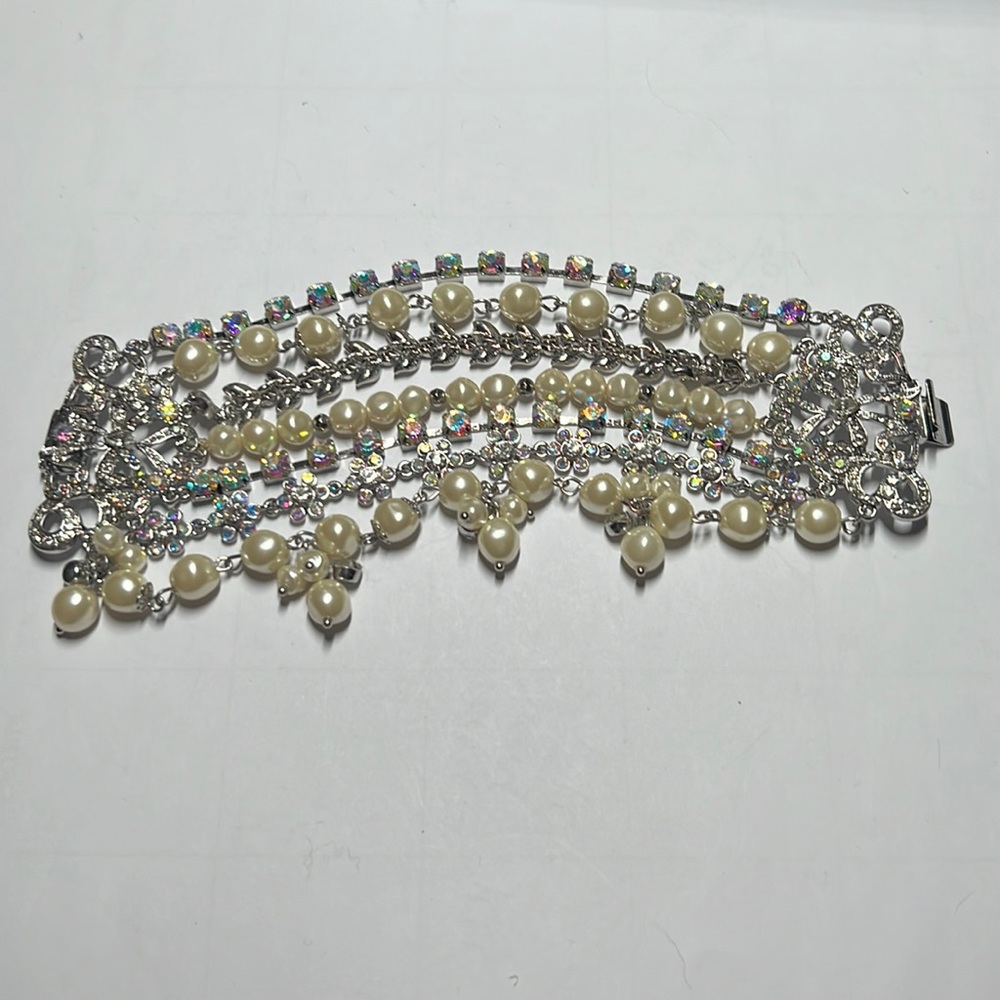 Wide aurora borealis rhinestone and pearl bracelet with silver closure